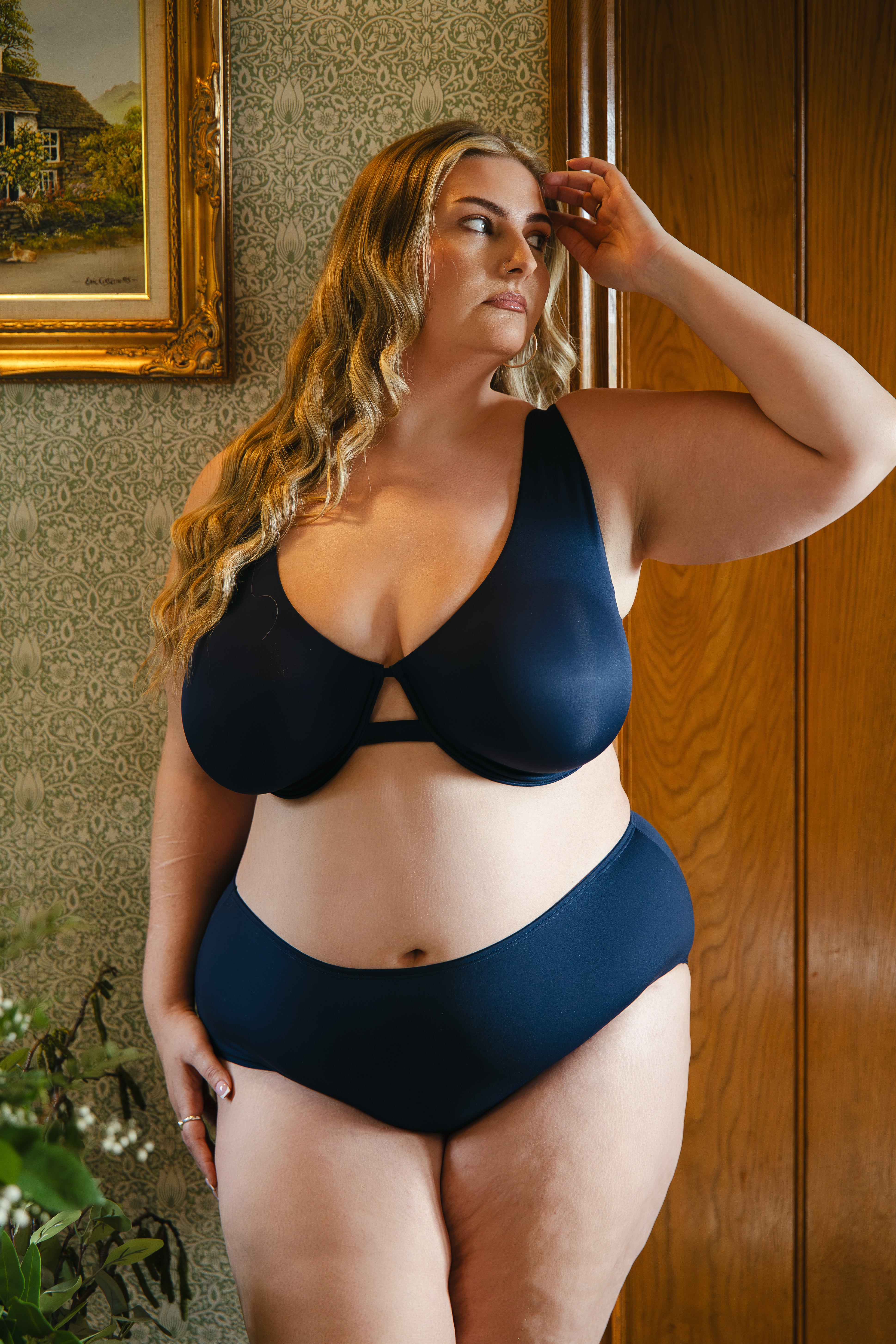 Model wearing midnight blue modal underwired bra and modal boyshort lingerie set