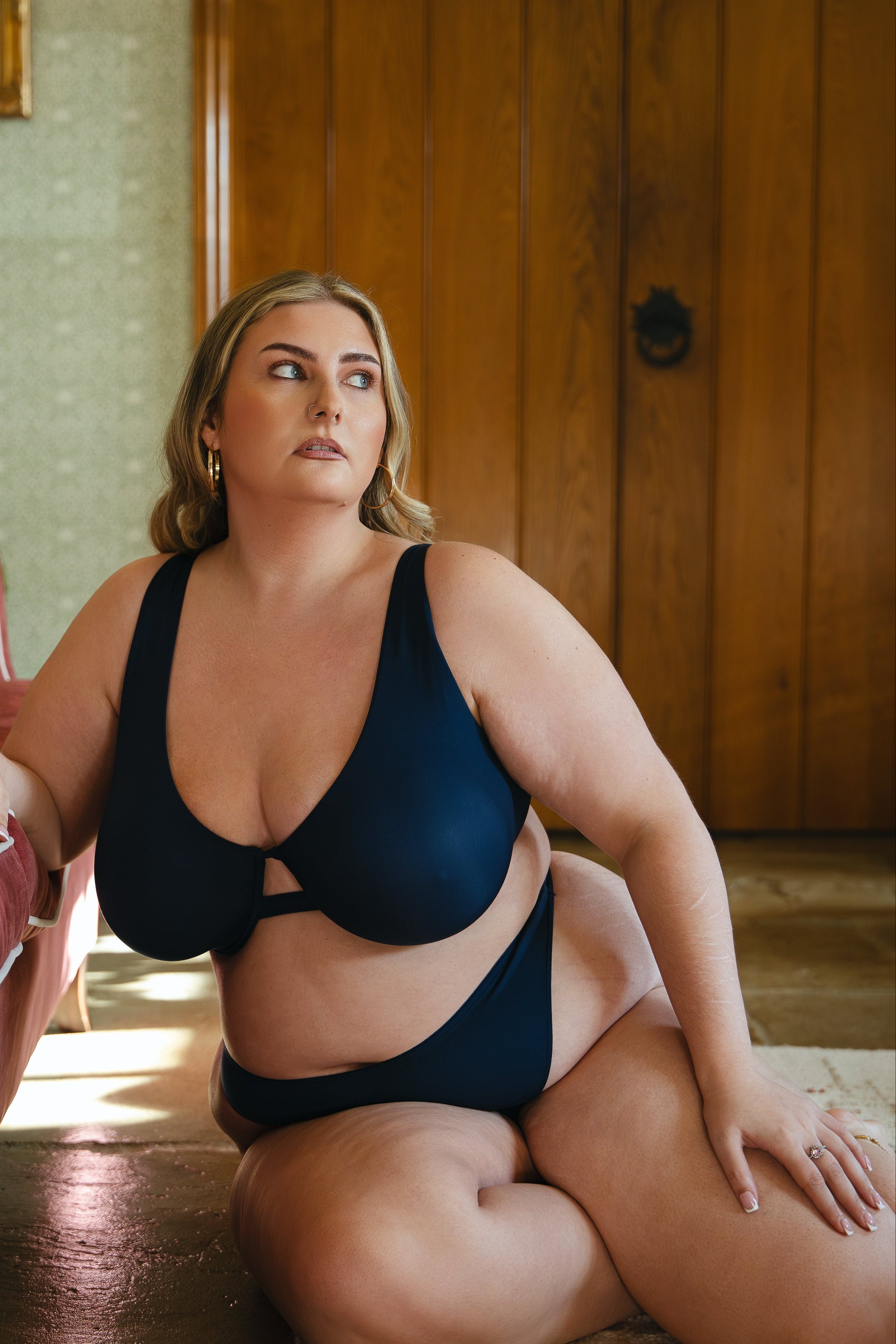 Model wearing midnight blue modal underwired bra and modal thong lingerie set