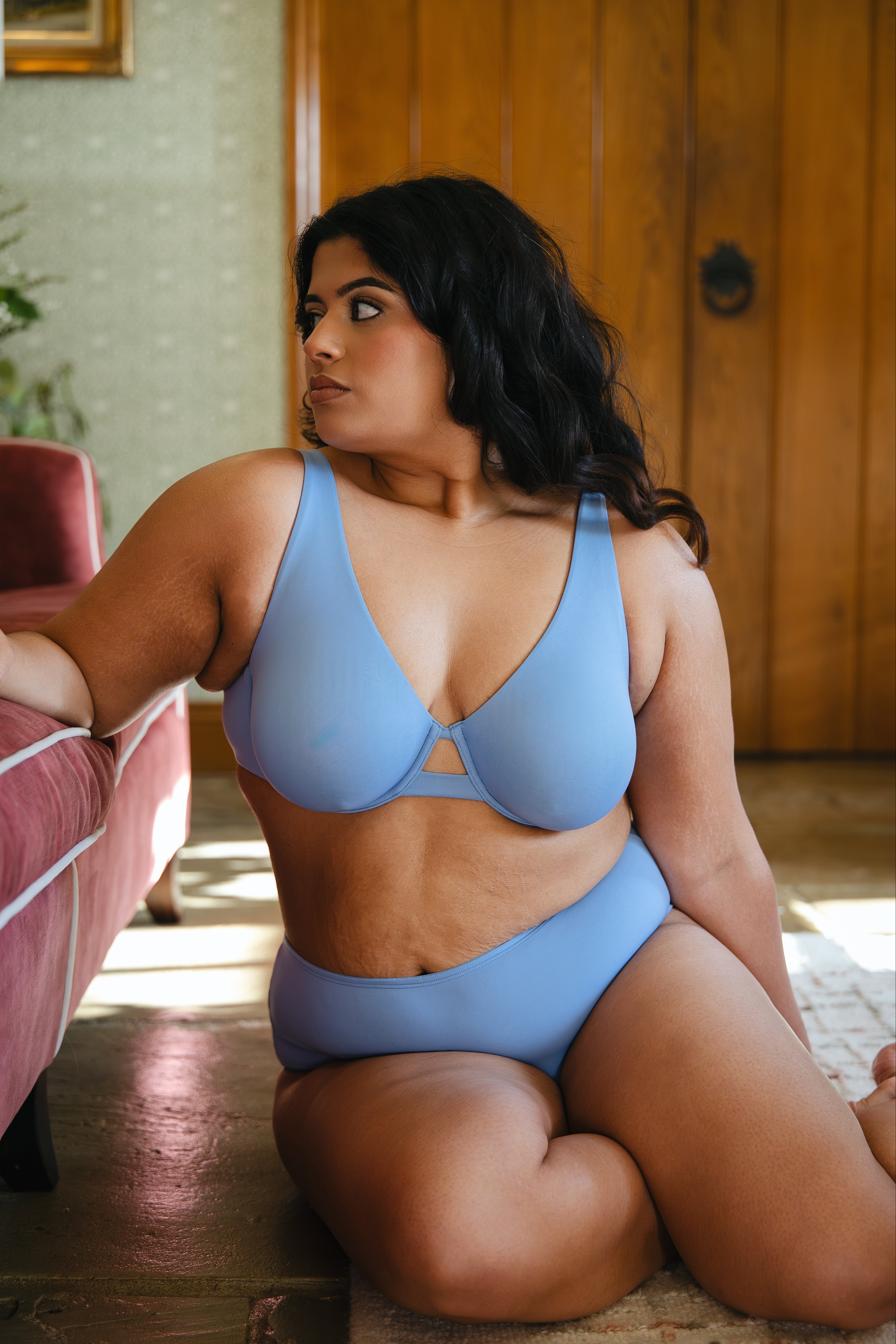 Model wearing modal cornflower blue underwired bra and modal boyshort lingerie set