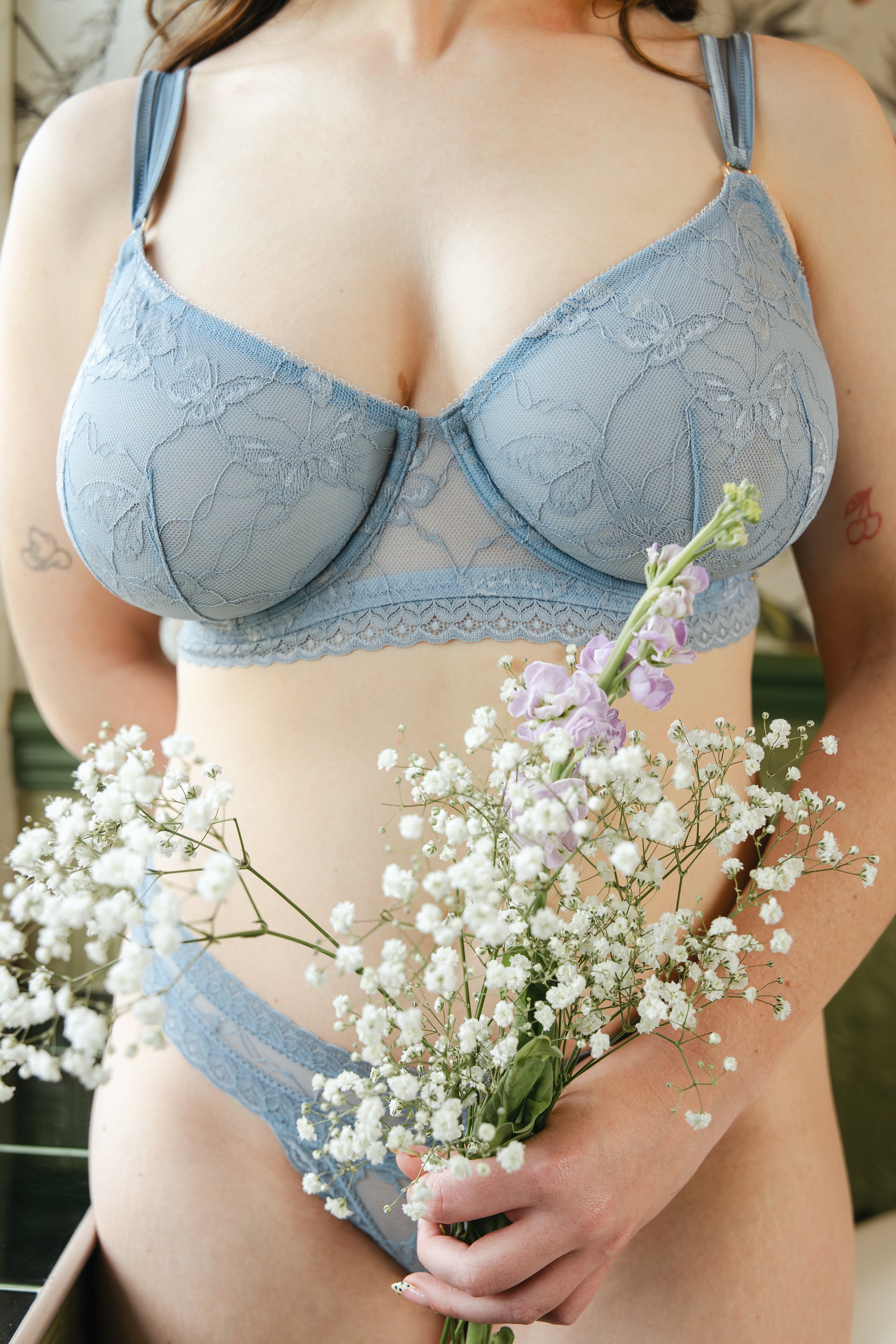 Model wearing kezia lace sculpt balconette bra in dusk blue, close up view